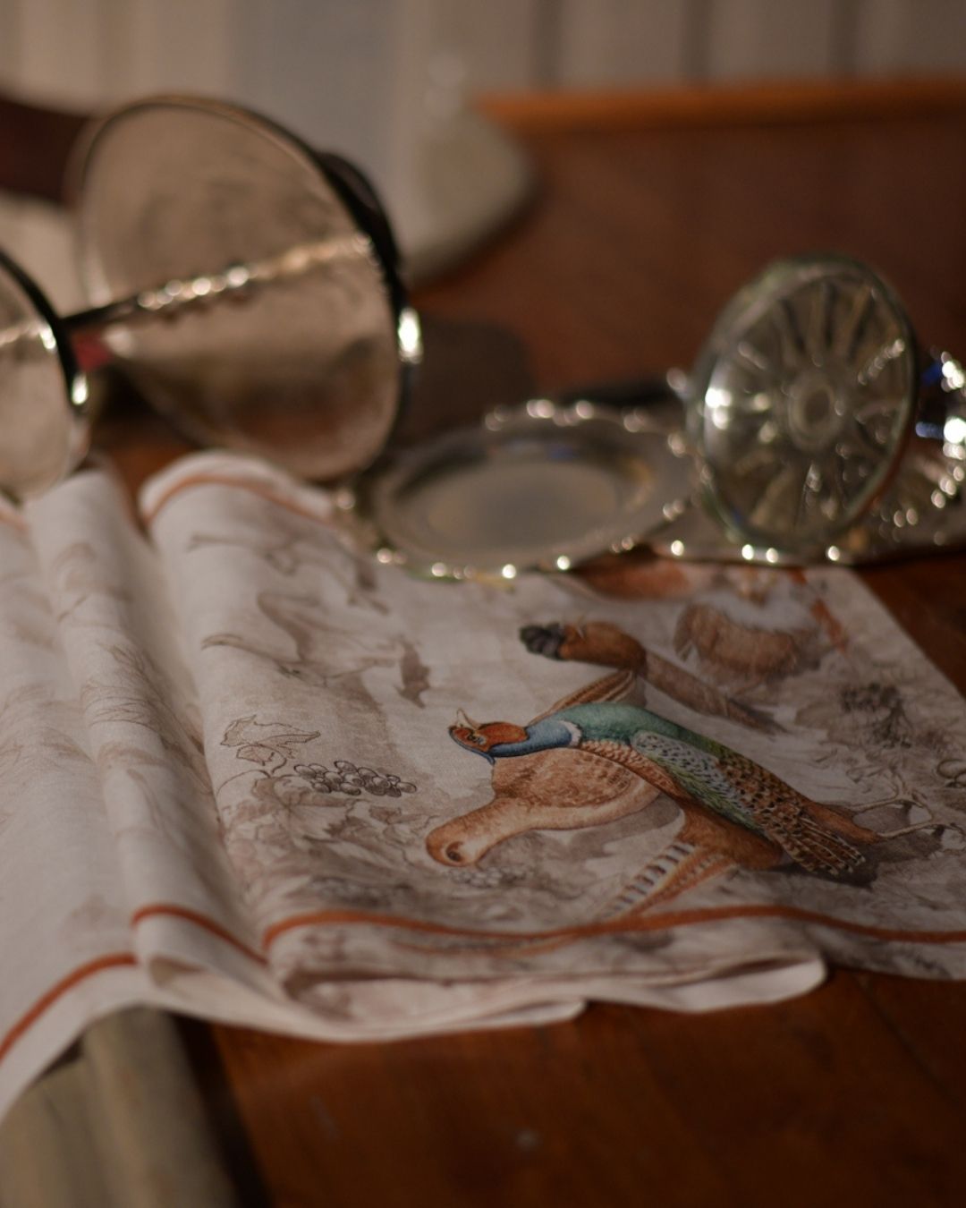 Close-up of Tessitura Toscana Norma runner with pheasant artwork