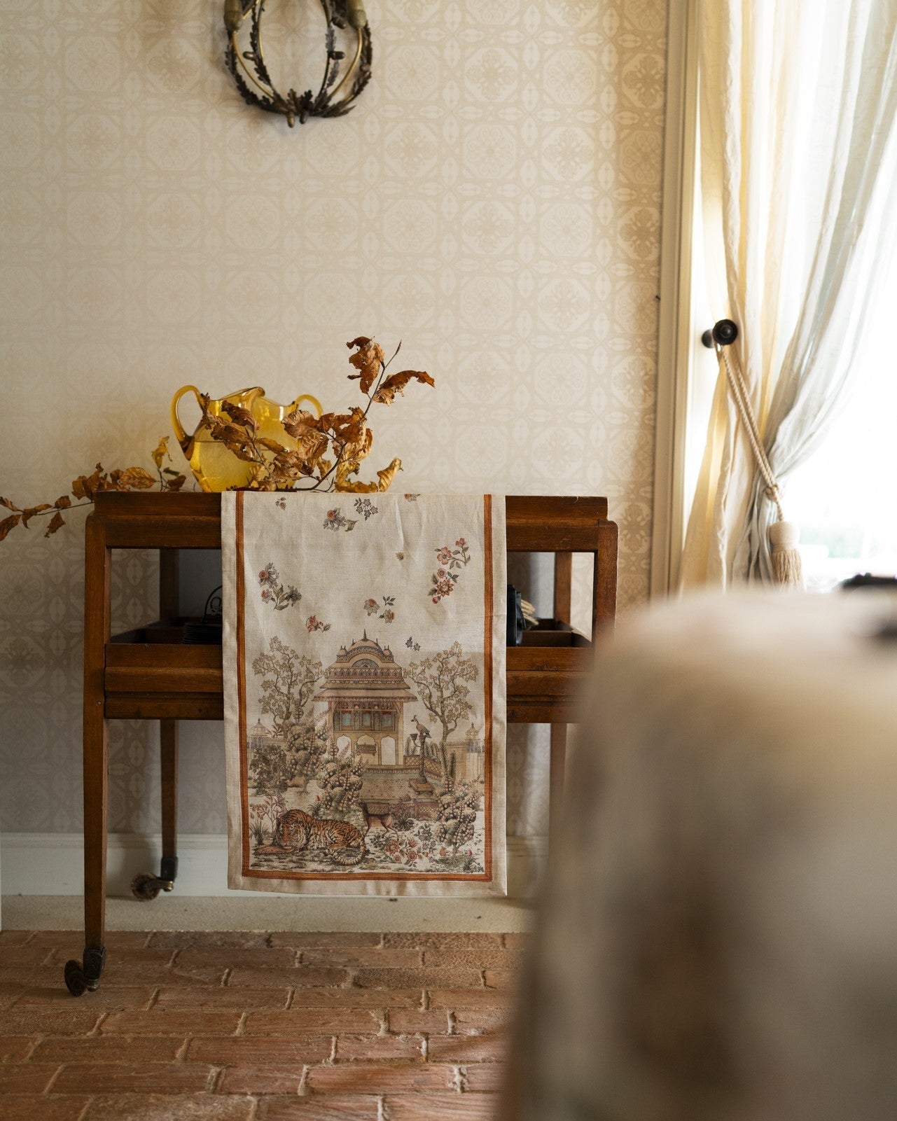 Mudra linen runner styled over a console