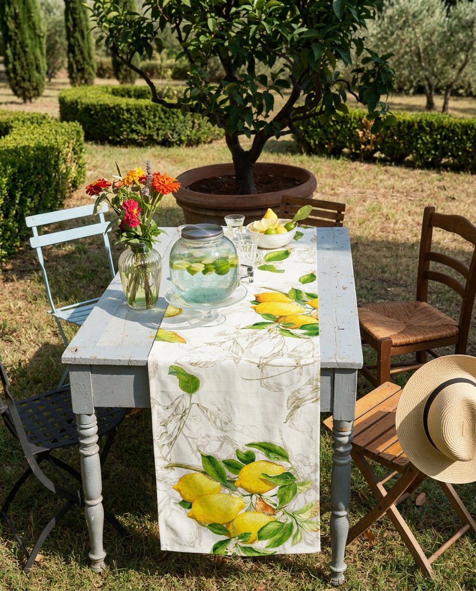 Limoncello linen runner styled on an outdoor dining table